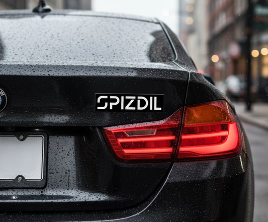SPIZDIL™ External Identity Matte Bumper Decal applied to a black BMW trunk — Weatherproof Vinyl Performance
