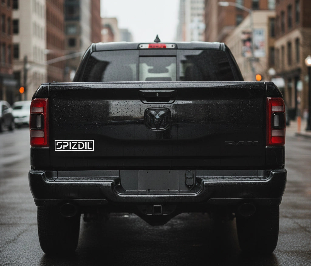 SPIZDIL™ External Identity Matte Bumper Decal on a Dodge Ram tailgate — Heavy Duty Exterior Grade Signet